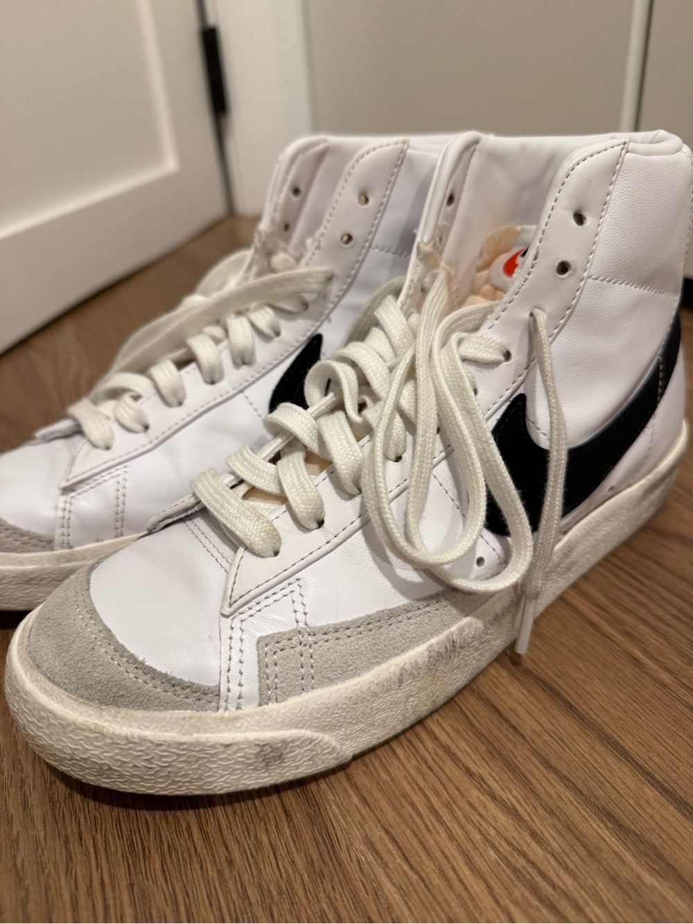 Nike White High-Top Sneakers with Black Swoosh - Women's